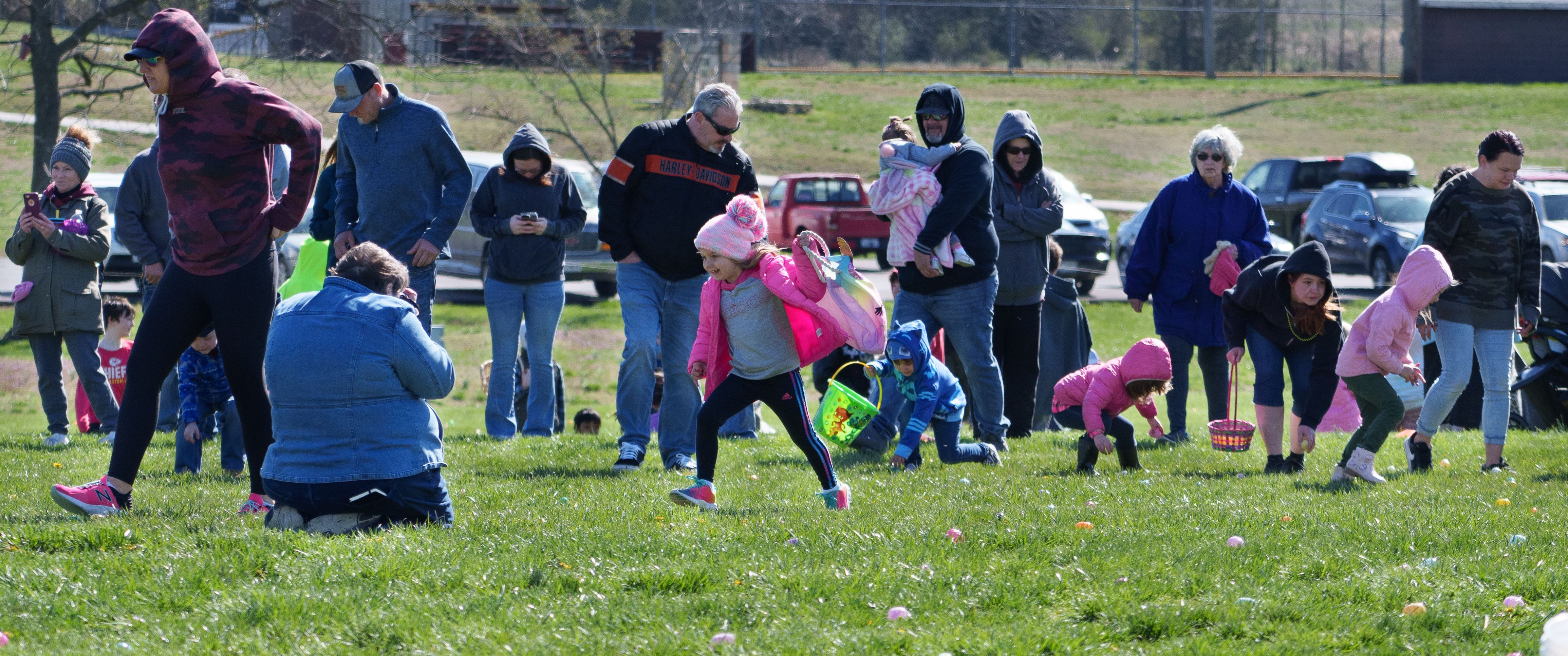 Photo of many children racing towards eggs